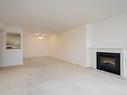 404-1560 Hillside Ave, Victoria, BC  - Indoor Photo Showing Living Room With Fireplace 