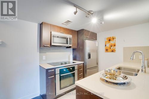 824 - 295 Adelaide Street W, Toronto, ON - Indoor Photo Showing Kitchen With Double Sink