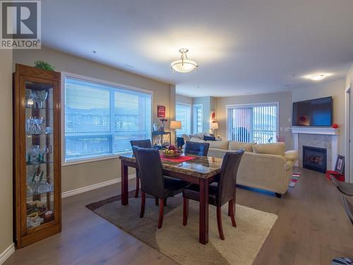 3388 Skaha Lake Road Unit# 403, Penticton, BC - Indoor Photo Showing Dining Room With Fireplace