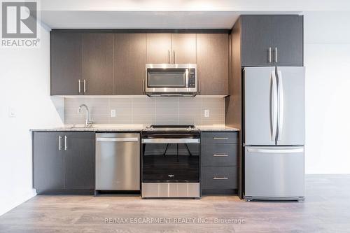 513 - 345 Wheat Boom Drive, Oakville, ON - Indoor Photo Showing Kitchen With Upgraded Kitchen