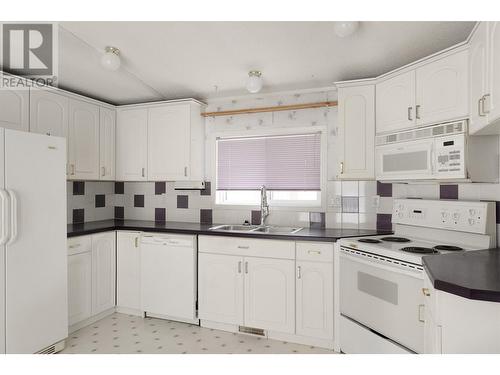 32 3889 Muller Avenue, Terrace, BC - Indoor Photo Showing Kitchen With Double Sink