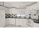 32 3889 Muller Avenue, Terrace, BC  - Indoor Photo Showing Kitchen With Double Sink 