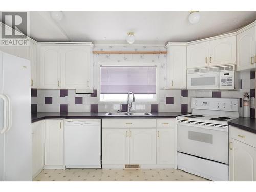 32 3889 Muller Avenue, Terrace, BC - Indoor Photo Showing Kitchen With Double Sink