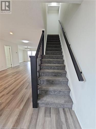 Staircase featuring wood-type flooring - 235 Chapel Hill Dr Drive Unit# 16, Kitchener, ON - Indoor Photo Showing Other Room