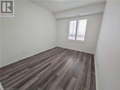 Spare room featuring dark hardwood / wood-style flooring - 235 Chapel Hill Dr Drive Unit# 16, Kitchener, ON - Indoor Photo Showing Other Room