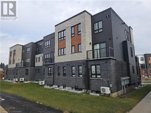 View of building exterior with ac unit - 235 Chapel Hill Dr Drive Unit# 16, Kitchener, ON - Outdoor