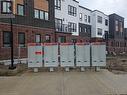 Surrounding community with mail boxes - 235 Chapel Hill Dr Drive Unit# 16, Kitchener, ON  - Outdoor With Facade 