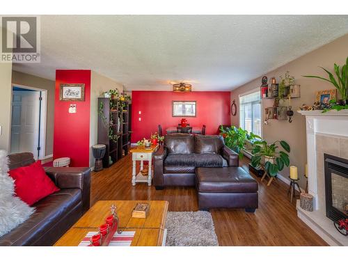 1120 8Th  S Street, Golden, BC - Indoor Photo Showing Living Room With Fireplace