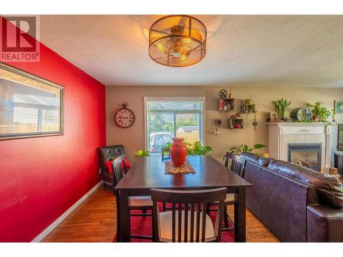 1120 8Th  S Street, Golden, BC - Indoor Photo Showing Dining Room With Fireplace