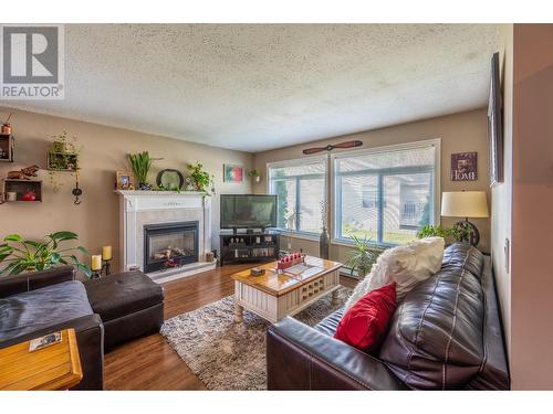 1120 8Th  S Street, Golden, BC - Indoor Photo Showing Living Room With Fireplace