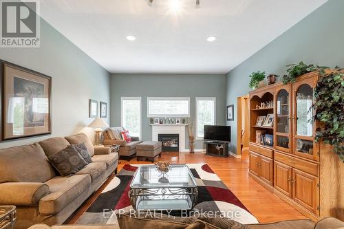 129 Simcoe Avenue, Middlesex Centre (Komoka), ON - Indoor Photo Showing Living Room With Fireplace