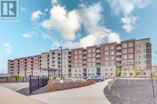 520 - 830 Megson Terrace, Milton, ON - Outdoor With Balcony With Facade