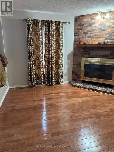 24 Sparrow Court, Brampton, ON - Indoor Photo Showing Other Room With Fireplace