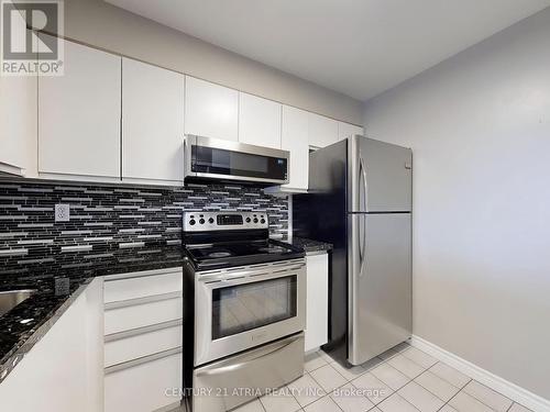 104 - 480 Mclevin Avenue, Toronto, ON - Indoor Photo Showing Kitchen