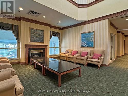 104 - 480 Mclevin Avenue, Toronto, ON - Indoor Photo Showing Living Room With Fireplace