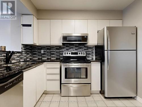 104 - 480 Mclevin Avenue, Toronto, ON - Indoor Photo Showing Kitchen With Upgraded Kitchen