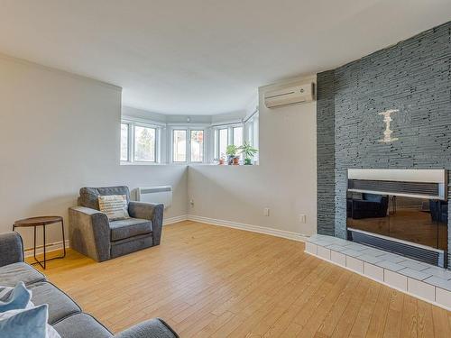 Living room - 14816 Rue Notre-Dame E., Montréal (Rivière-Des-Prairies/Pointe-Aux-Trembles), QC - Indoor Photo Showing Living Room With Fireplace