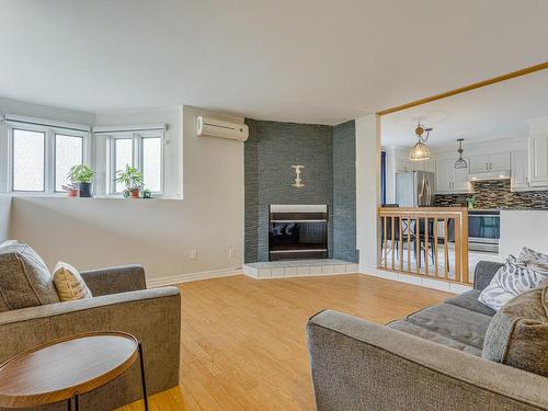 Overall view - 14816 Rue Notre-Dame E., Montréal (Rivière-Des-Prairies/Pointe-Aux-Trembles), QC - Indoor Photo Showing Living Room With Fireplace