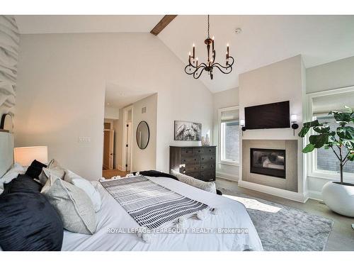 84 Blantyre Ave, Toronto, ON - Indoor Photo Showing Bedroom With Fireplace