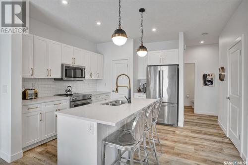 271 Prasad Manor, Saskatoon, SK - Indoor Photo Showing Kitchen With Stainless Steel Kitchen With Double Sink With Upgraded Kitchen