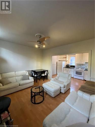 Living room with ceiling fan and light hardwood / wood-style floors - 522 Roxborough Avenue Unit# #1, Hamilton, ON - Indoor Photo Showing Living Room