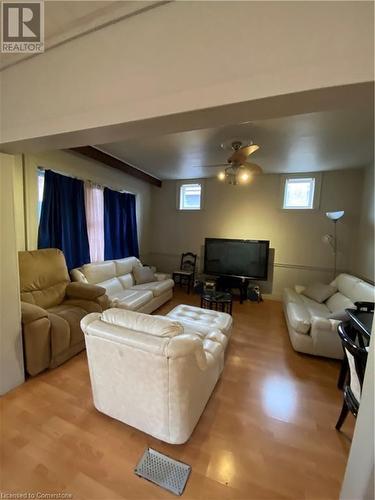 Living room featuring ceiling fan, plenty of natural light, and light wood-type flooring - 522 Roxborough Avenue Unit# #1, Hamilton, ON - Indoor