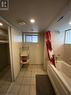 Bathroom with tile patterned floors and shower / tub combo - 522 Roxborough Avenue Unit# #1, Hamilton, ON  - Indoor Photo Showing Bathroom 