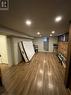 Basement featuring dark wood-type flooring - 522 Roxborough Avenue Unit# #1, Hamilton, ON  - Indoor 