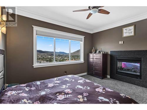 842 Guerin Creek Way, Kamloops, BC - Indoor Photo Showing Bedroom With Fireplace