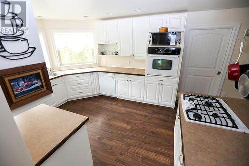 1612 Flume Road, Barriere, BC - Indoor Photo Showing Kitchen With Fireplace