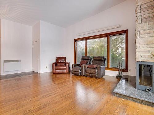 Living room - 600  - 600A Rue Franchère, Laval (Duvernay), QC - Indoor Photo Showing Living Room With Fireplace