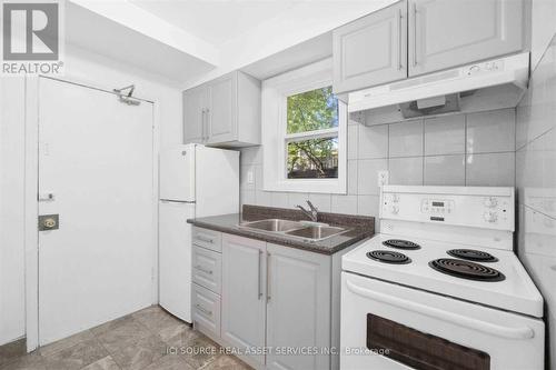 1 - 110 Eastwood Road, Toronto, ON - Indoor Photo Showing Kitchen With Double Sink