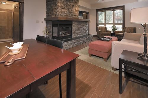 1107-7495 Columbia Avenue, Radium Hot Springs, BC - Indoor Photo Showing Living Room With Fireplace