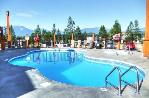 1107-7495 Columbia Avenue, Radium Hot Springs, BC - Outdoor With In Ground Pool With Backyard