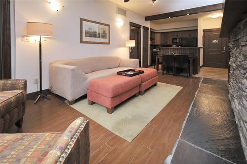 1107-7495 Columbia Avenue, Radium Hot Springs, BC - Indoor Photo Showing Living Room With Fireplace