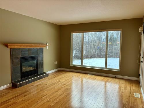 119 Mountain Side Drive, Fruitvale, BC - Indoor Photo Showing Living Room With Fireplace