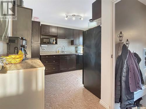 542 104Th Street, North Battleford, SK - Indoor Photo Showing Kitchen With Double Sink