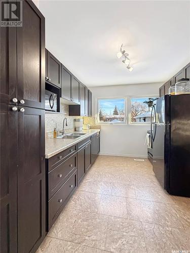 542 104Th Street, North Battleford, SK - Indoor Photo Showing Kitchen With Double Sink