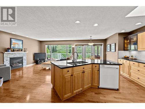 3639 Overlander Drive, Kamloops, BC - Indoor Photo Showing Kitchen With Fireplace With Double Sink