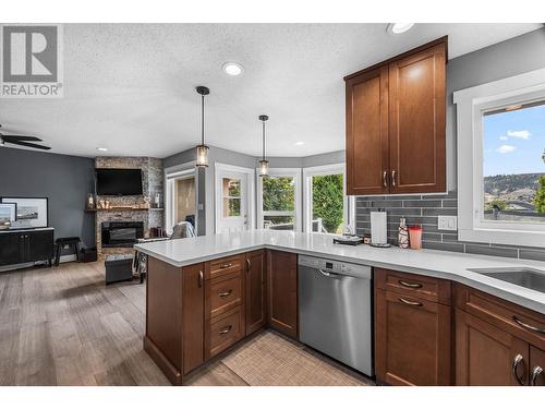 3568 Navatanee Drive, Kamloops, BC - Indoor Photo Showing Kitchen With Fireplace