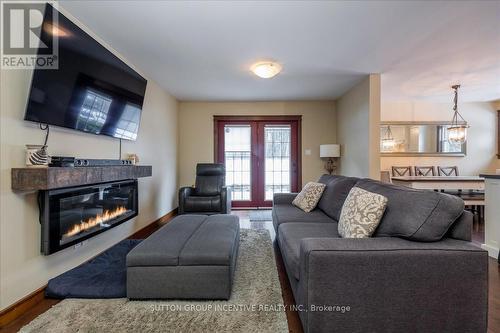 2084 Sunnidale Road, Springwater, ON - Indoor Photo Showing Living Room With Fireplace