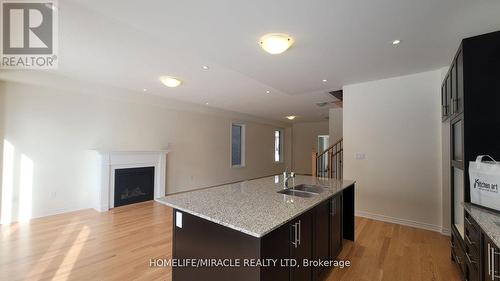 2074 Hallandale Street, Oshawa, ON - Indoor Photo Showing Kitchen With Fireplace With Double Sink