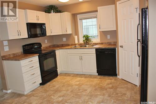 137 503 Colonel Otter Drive, Swift Current, SK - Indoor Photo Showing Kitchen With Double Sink