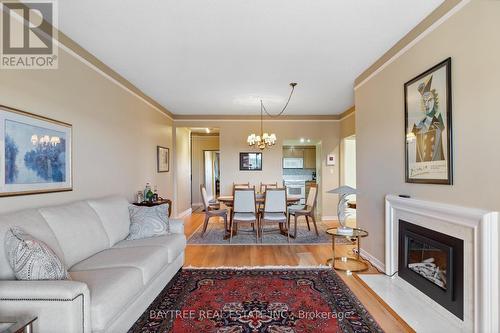 803 - 3663 Riverside Drive E, Windsor, ON - Indoor Photo Showing Living Room With Fireplace