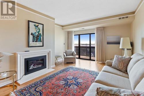 803 - 3663 Riverside Drive E, Windsor, ON - Indoor Photo Showing Living Room With Fireplace