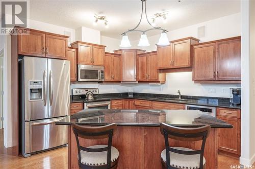 304 401 Cartwright Street, Saskatoon, SK - Indoor Photo Showing Kitchen With Double Sink