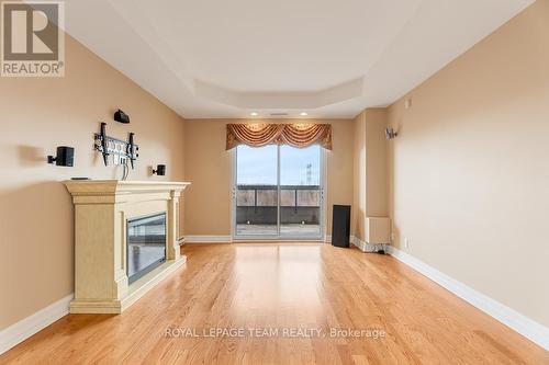 506 - 3580 Rivergate Way, Ottawa, ON - Indoor Photo Showing Other Room With Fireplace