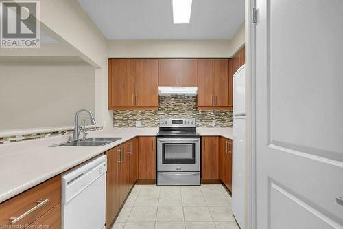 760 Woodhill Drive Unit# 219, Centre Wellington, ON - Indoor Photo Showing Kitchen With Double Sink