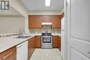 760 Woodhill Drive Unit# 219, Centre Wellington, ON  - Indoor Photo Showing Kitchen With Double Sink 