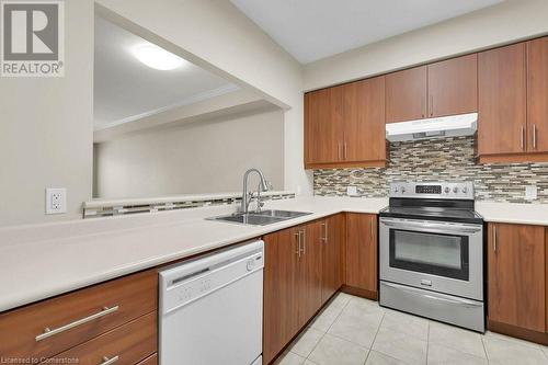 760 Woodhill Drive Unit# 219, Centre Wellington, ON - Indoor Photo Showing Kitchen With Double Sink